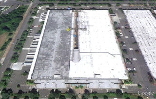 Google Maps aerial view of a finished roof on a 390,000 Square Foot Packaging Facility.