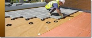 Photo of a roofing tile job and a Stanley Roofing Kent roofing technician laying tile.