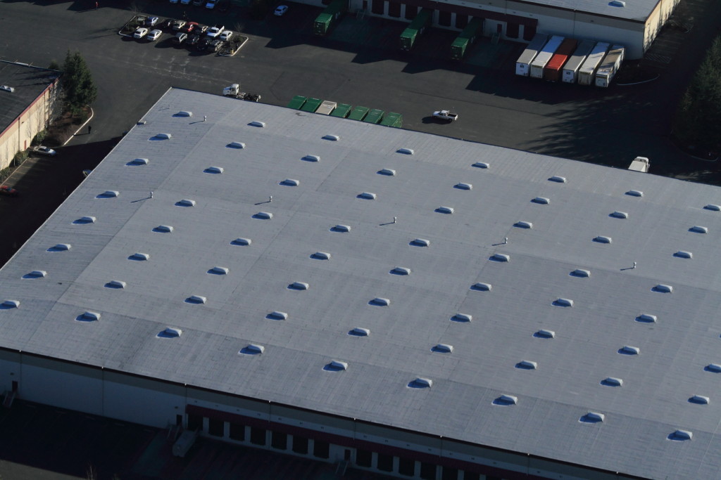 Aerial view of a Malarkey built-up hot tar roof.