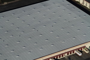 Aerial view of a Malarkey built-up hot tar roof.
