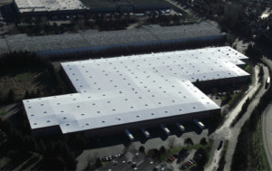 Aerial view of a Sarnafil 60 mil single-ply membrane roof for Ace Hardware distribution center.